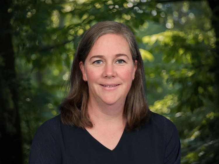 Photo of Keli Golledge, Deputy Principal in front of trees