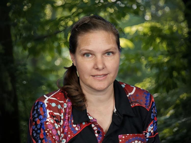 Photo of Della Philp, Rel. Deputy Principal in front of trees